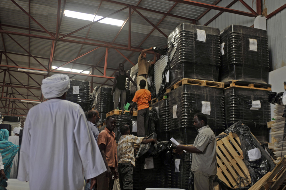 Poll workers at a warehouse.