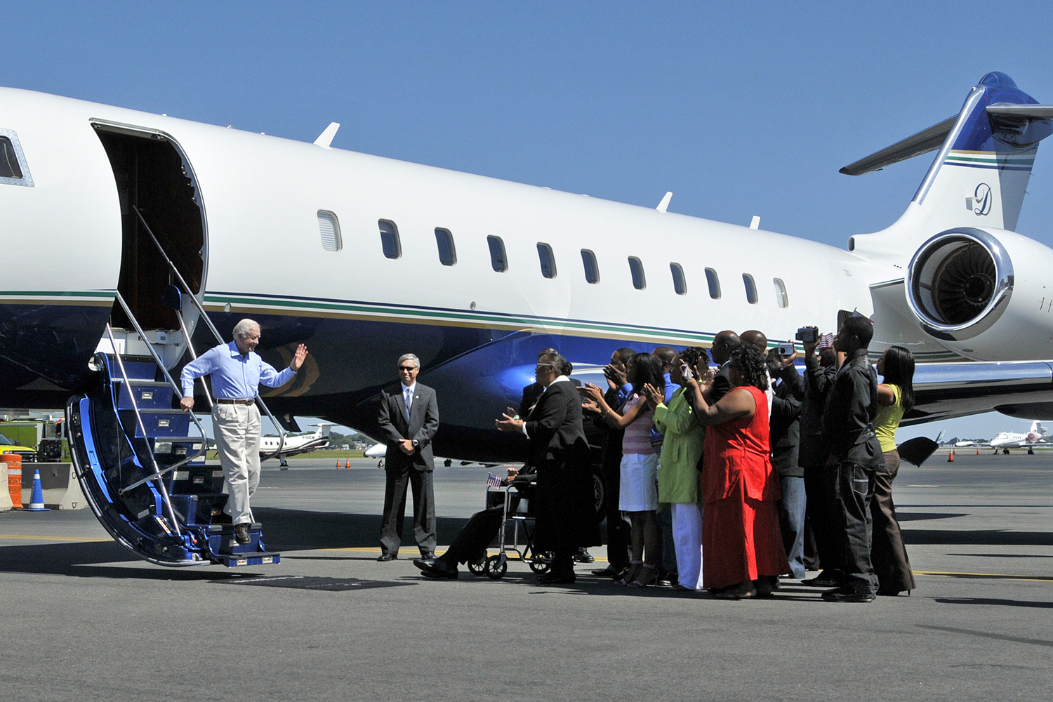 The family of Aijalon Gomes greets Jimmy Carter.