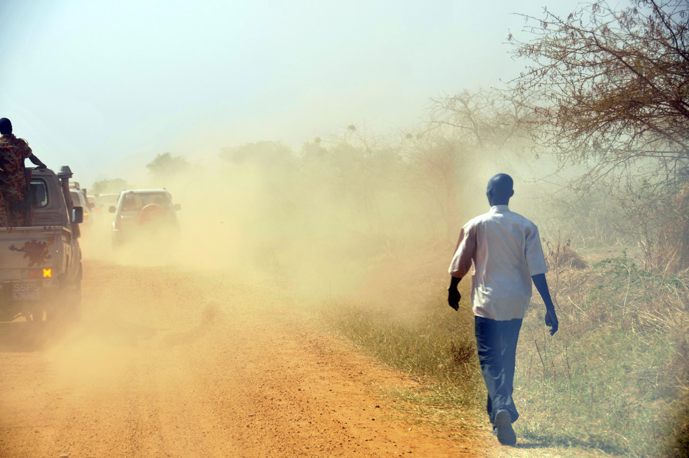 President Carter's motorcade travels down a dusty road to reach the next polling center to observe on Jan. 10.