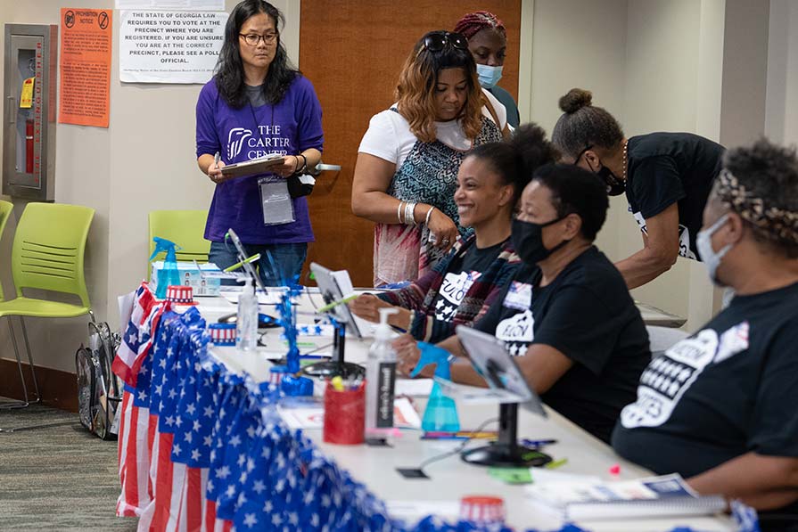 Connie Moon Sehat monitors election